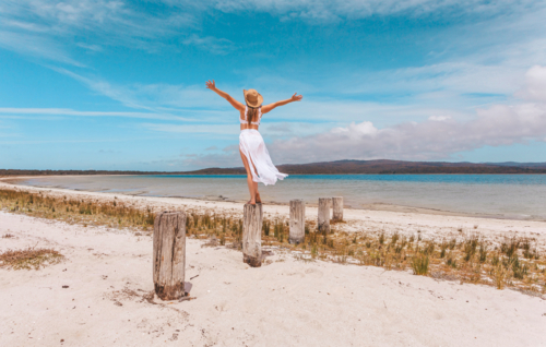 Female joy freedom live life to the full travel beach concept - Australian Stock Image