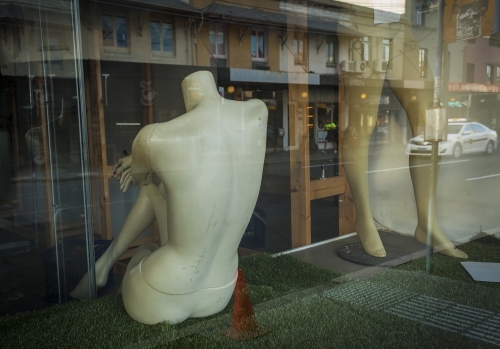 Female mannequin's back on a store.