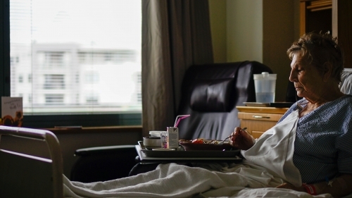 Female patient is hospital bed - Australian Stock Image