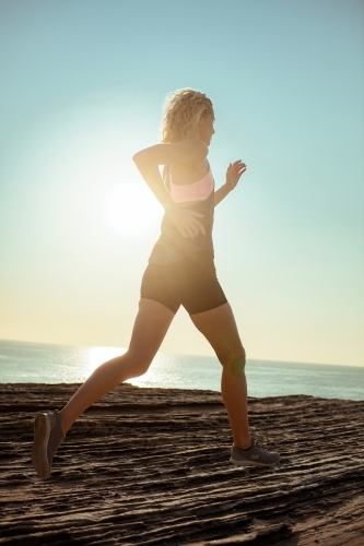 Female runner Morning Cliffside - Australian Stock Image