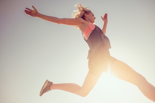 Female runner Morning Cliffside - Australian Stock Image
