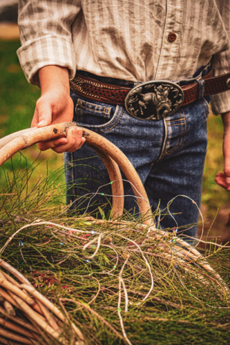 Festive basket held by young child in country - Australian Stock Image