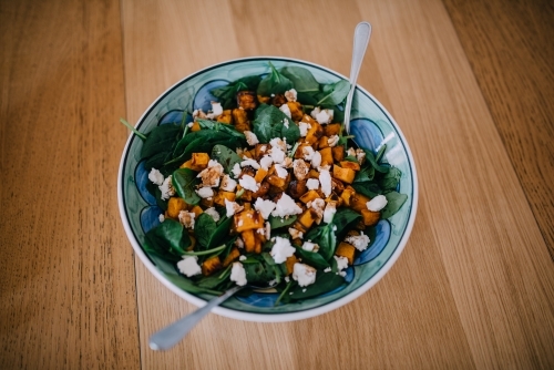 Feta, pumpkin and spinach salad - Australian Stock Image