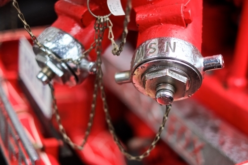 Fire hose couplings on a firetruck - Australian Stock Image