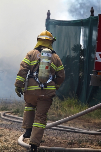 Firefighter with breathing apparatus - Australian Stock Image
