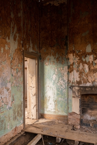 fireplace and doorway in old abandoned building - Australian Stock Image