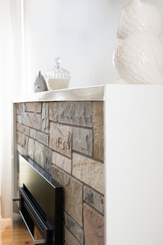 Fireplace with stone fascia - Australian Stock Image