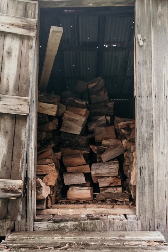 Firewood stacked in the shed.