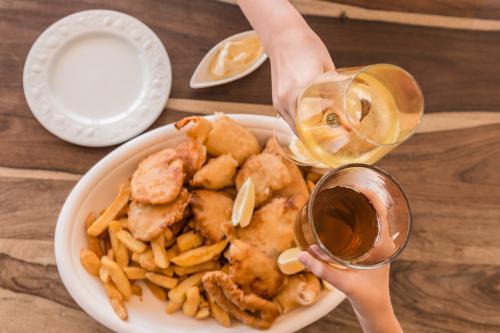 fish and chips in a large dish - Australian Stock Image
