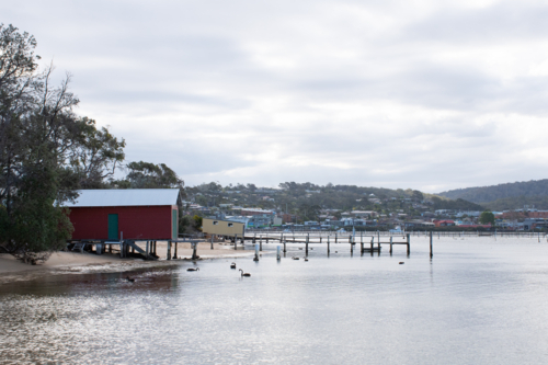 Fishing huts on water in Merimbula - Australian Stock Image