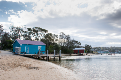 Fishing shacks along the beach at Merimbula - Australian Stock Image