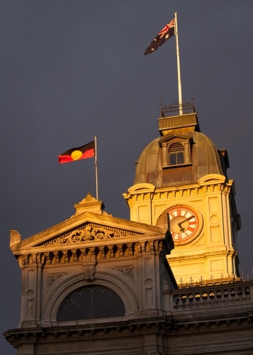 Flags flying above a heritage building - Australian Stock Image