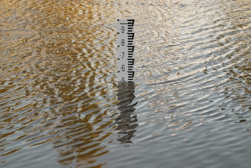 Flood depth gauge marking the depth of water in a frequently flooding area.