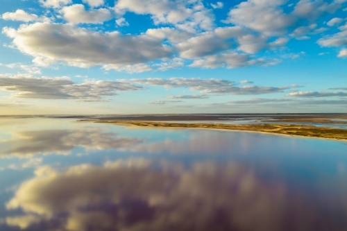 Flying with a drone over a salt lake with reflections - Australian Stock Image
