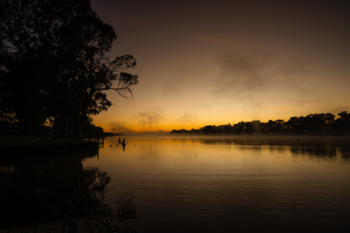 Fog mist morning on river at Mannum - Australian Stock Image
