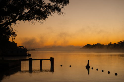 Fog mist morning on river at Mannum - Australian Stock Image