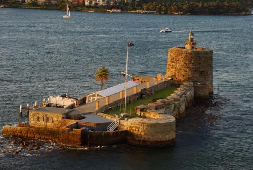 Fort Denison in Sydney Harbour with the light of the setting sun - Australian Stock Image