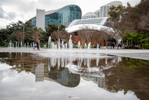 Fountain and reflection at Tumbalong Park, Darling Harbour - Australian Stock Image