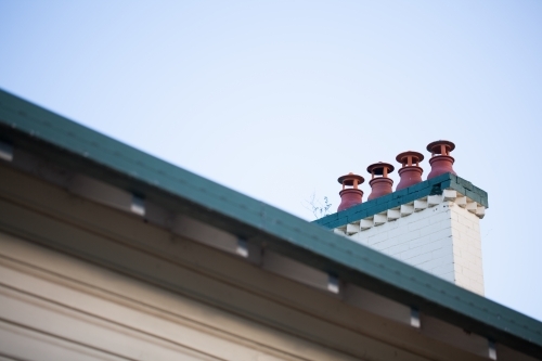 Four chimney vents on a roof - Australian Stock Image