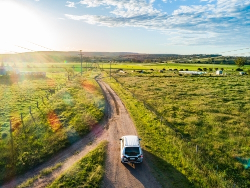 Four wheel drive car on country road trip driving on gravel road - Hope and adventure concept - Australian Stock Image