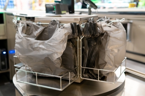 Free plastic bags for customers in shopping centre - Australian Stock Image