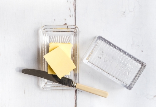 Fresh butter in a butter dish. - Australian Stock Image