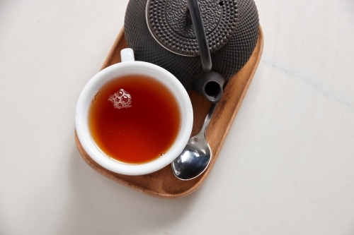 Fresh cup of tea served on table - Australian Stock Image