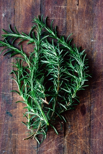 fresh rosemary on a wooden board