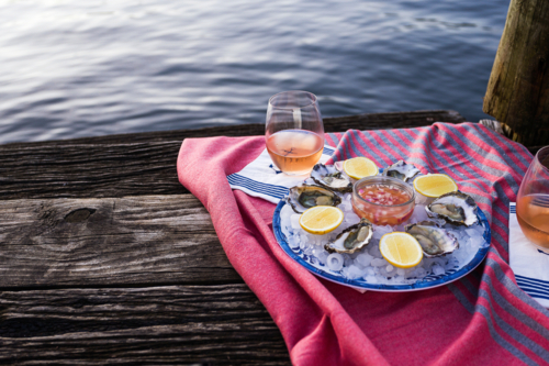 Fresh seafood on ice and rose with a water view - Australian Stock Image