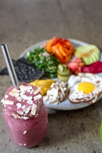 Fresh smoothie and healthy vegetarian meal ready to eat - Australian Stock Image