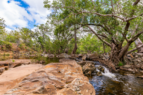 Fresh water creek and amongst boulders in the summer - Australian Stock Image