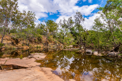 Fresh water creek and swimming hole in the summer - Australian Stock Image