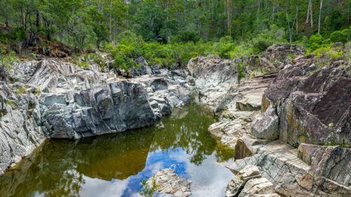 Fresh water swimming hole in the summer - Australian Stock Image