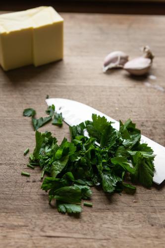 freshly chopped parsley with butter and garlic - Australian Stock Image