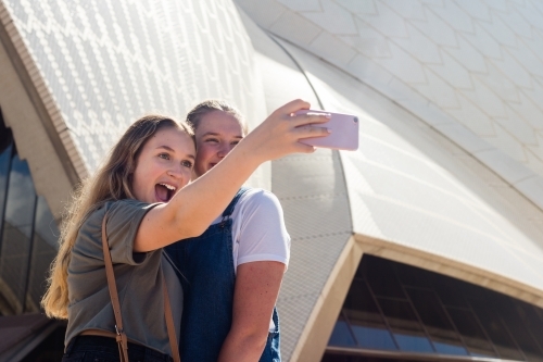 friends taking selfie at sydney opera house - Australian Stock Image