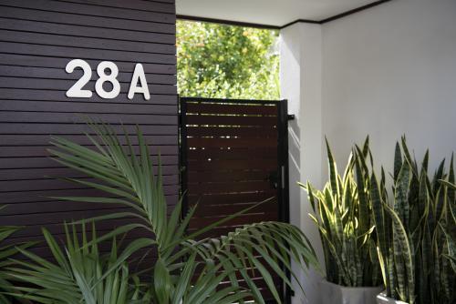 Front entry to stylish home unit with plants - Australian Stock Image
