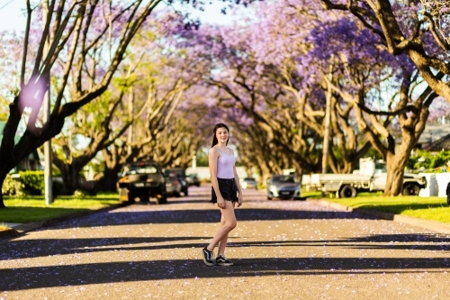 Full length portrait of a young teen girl standing in street of country town - Australian Stock Image