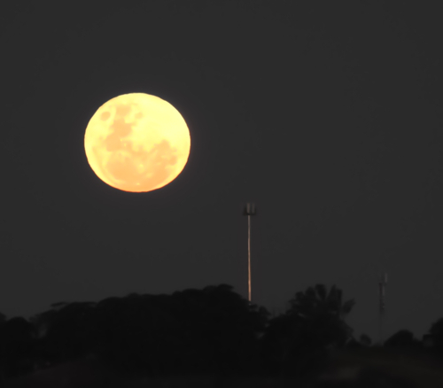 full moon mt annan with communications towers - Australian Stock Image
