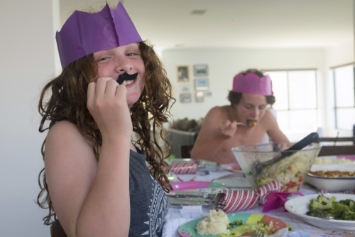 Funny girl at christmas dinner - Australian Stock Image