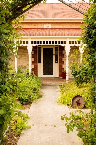 Garden path leading to front door of old house - Australian Stock Image