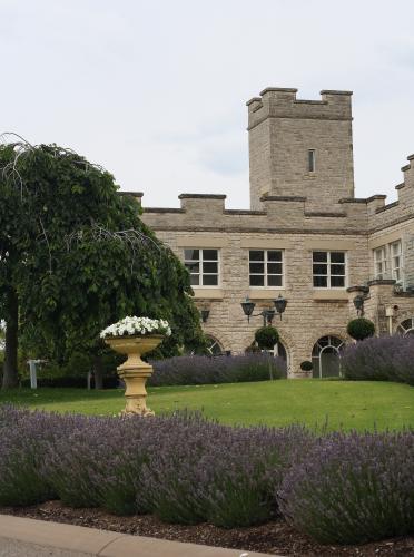 Gardens and castle walls of a private residence on an overcast day - Australian Stock Image