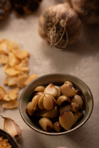 Garlic bulb with cloves and garlic chips - Australian Stock Image