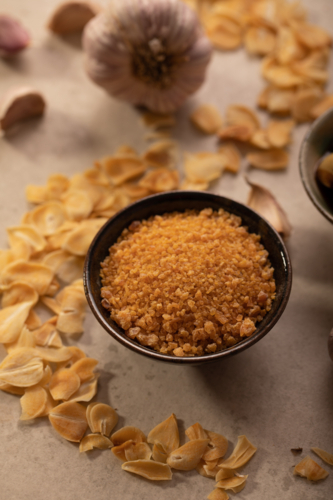 Garlic salt powder in bowl - Australian Stock Image