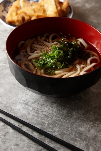 Garnished noodle soup with chicken katsu - Australian Stock Image