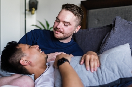 gay couple hanging out at home - Australian Stock Image