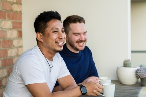 gay couple having a coffee - Australian Stock Image