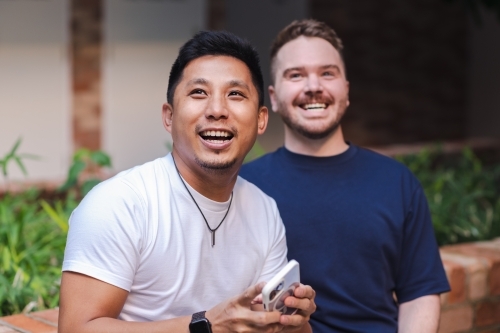 gay men laughing - Australian Stock Image