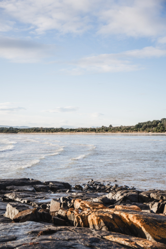gentle waves at Greens beach - Australian Stock Image