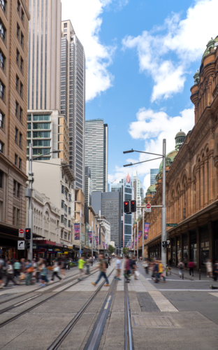 George Street with tram track and pedestrians crossing road - Australian Stock Image