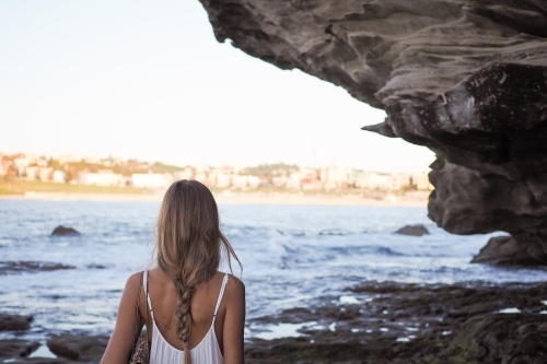 Girl Beside Rocks Looking onto Bondi Beach